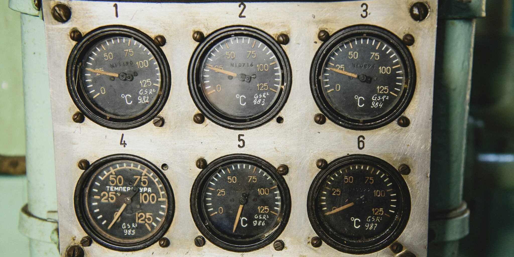 a close up of a bunch of gauges on a pole